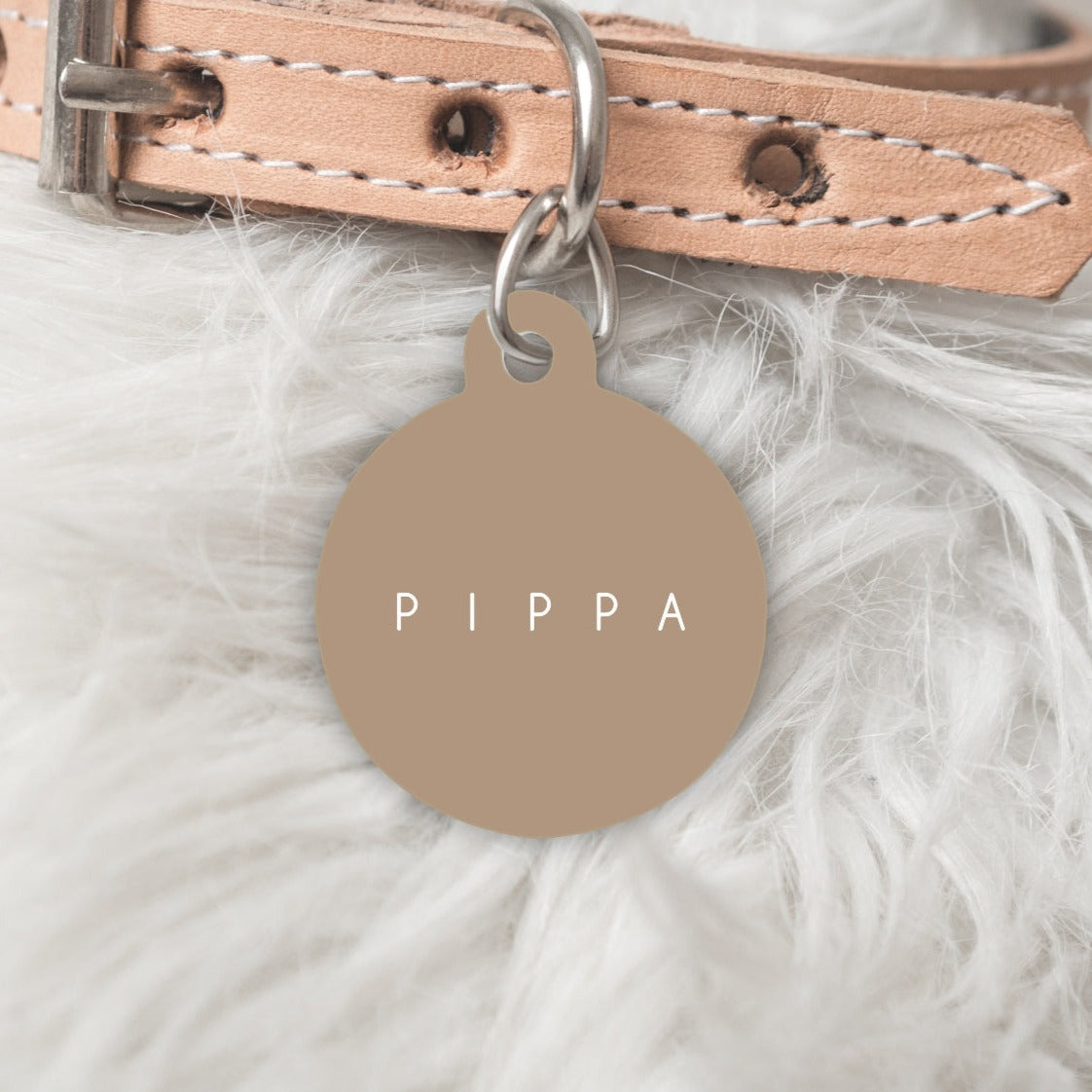 Brown dog tag with pets name