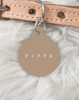 Brown dog tag with pets name